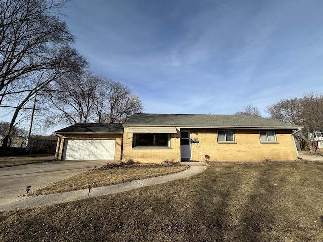 ranch-style house with brick siding, a garage, and driveway