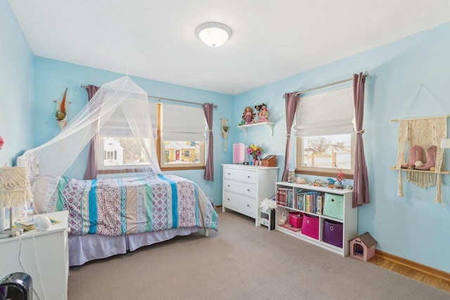 bedroom with carpet and baseboards