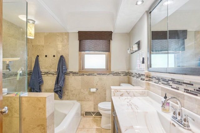 bathroom with tile patterned floors, visible vents, an enclosed shower, toilet, and tile walls