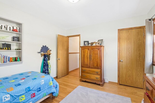 bedroom featuring light wood-type flooring