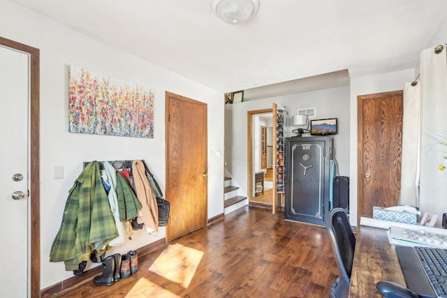 home office with baseboards and hardwood / wood-style floors