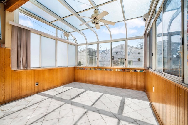 unfurnished sunroom featuring plenty of natural light and ceiling fan