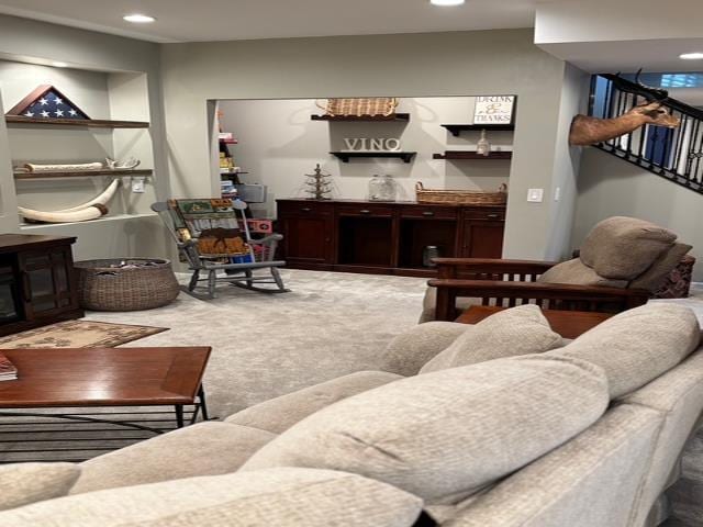 carpeted living area with recessed lighting