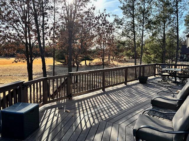 wooden deck with outdoor dining area