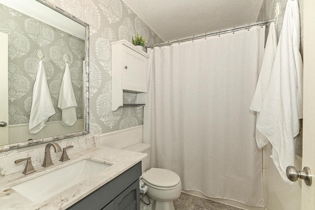 bathroom featuring toilet, wallpapered walls, vanity, and a shower with curtain