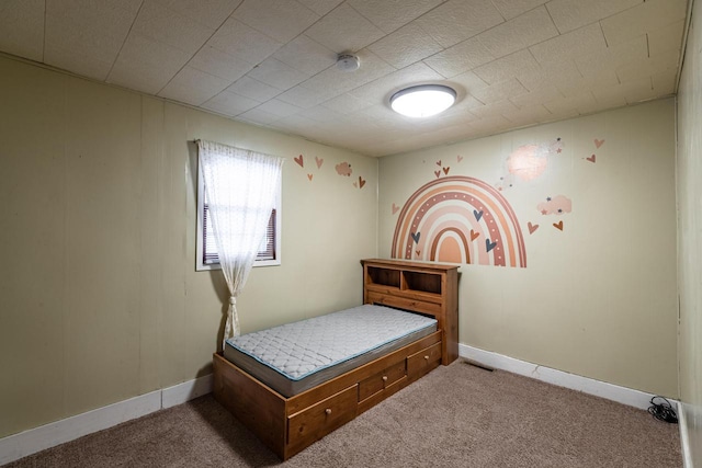 bedroom with baseboards, visible vents, and carpet floors