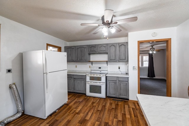 kitchen featuring light countertops, gray cabinets, white appliances, a textured ceiling, and dark wood-style flooring