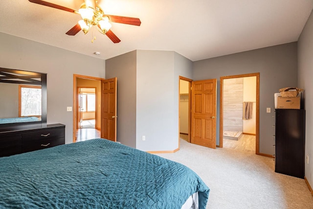 carpeted bedroom with baseboards and a ceiling fan