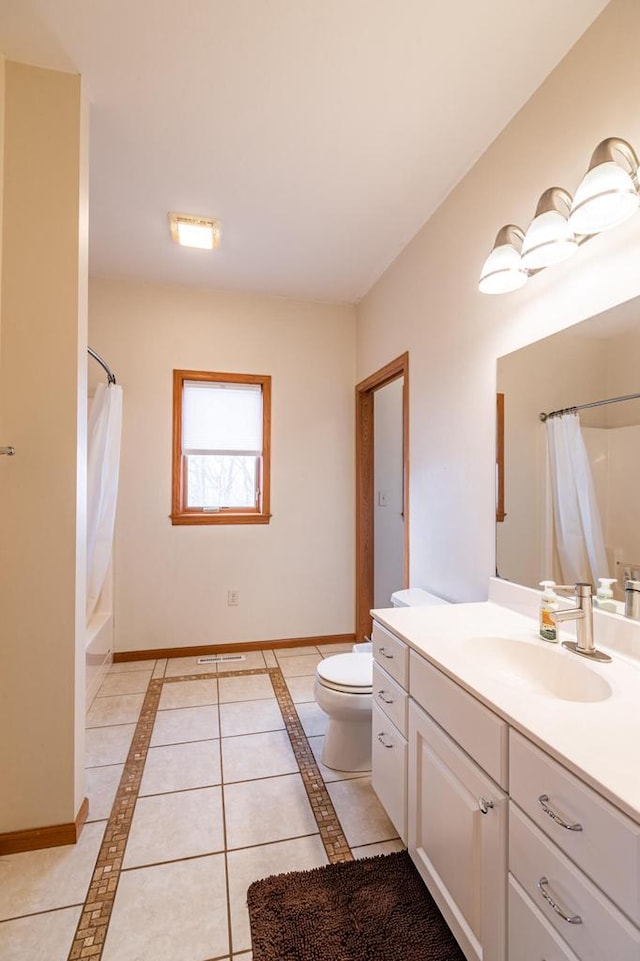 full bath featuring vanity, tile patterned floors, toilet, and baseboards