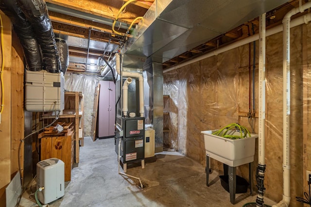 unfinished basement featuring heating unit