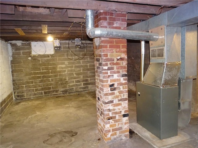 unfinished below grade area featuring heating unit