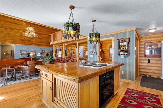 kitchen with rustic walls, light wood-style flooring, white electric stovetop, and wood counters