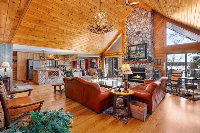 living room with wooden ceiling, a fireplace, and light wood-type flooring