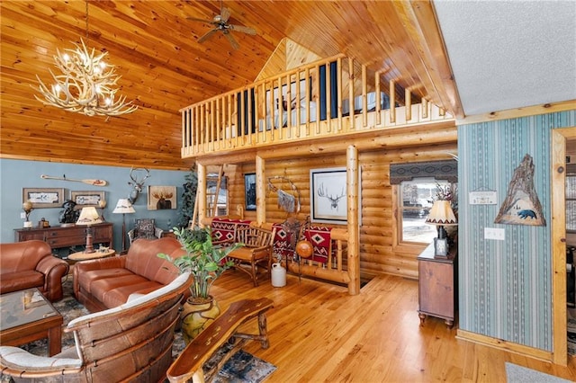 living area with wood finished floors, high vaulted ceiling, log walls, wooden ceiling, and ceiling fan with notable chandelier