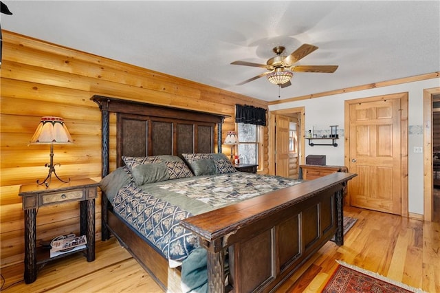 bedroom with light wood finished floors and ceiling fan