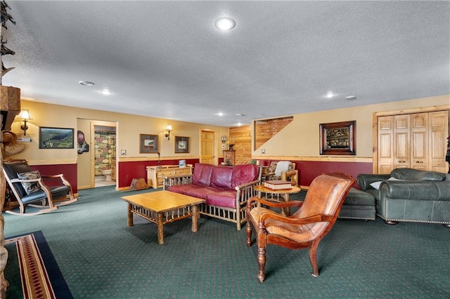 carpeted living area with recessed lighting and a textured ceiling