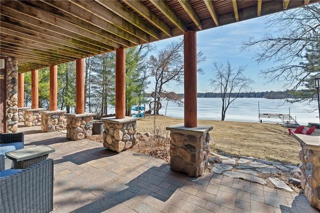 view of patio / terrace with a water view