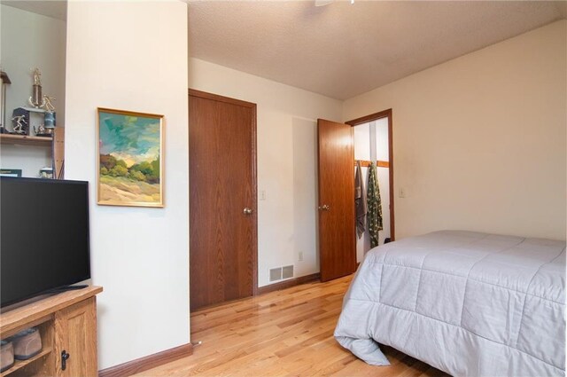 227 Donatelle St, Amery, WI 54001 - bedroom with visible vents, baseboards, and light wood finished floors