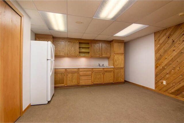 227 Donatelle St, Amery, WI 54001 - kitchen featuring open shelves, light countertops, wood walls, and freestanding refrigerator