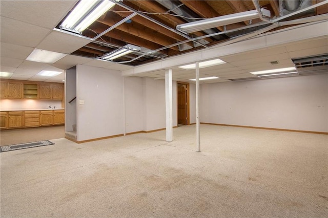 227 Donatelle St, Amery, WI 54001 - finished basement with a drop ceiling, baseboards, and light colored carpet