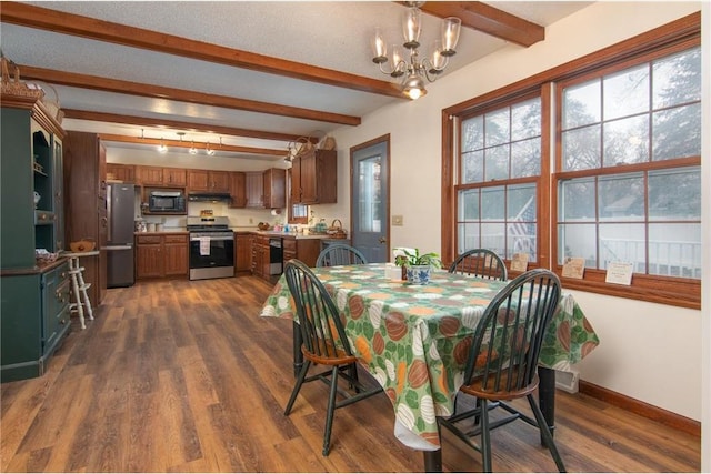 227 Donatelle St, Amery, WI 54001 - dining room featuring beam ceiling, dark wood-style floors, an inviting chandelier, and baseboards