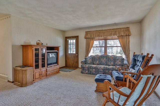 living area with carpet flooring and baseboards