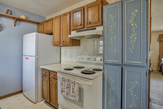 kitchen featuring under cabinet range hood, white appliances, brown cabinetry, and wallpapered walls