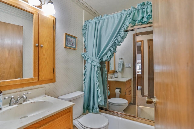 bathroom with bathing tub / shower combination, toilet, vanity, and wallpapered walls