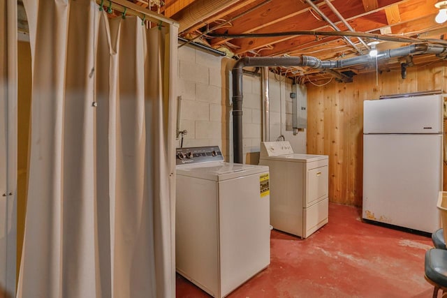 laundry room featuring electric panel, independent washer and dryer, and laundry area