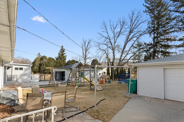 exterior space with outdoor dining area, a playground, and an outdoor structure