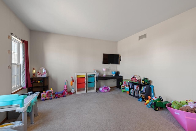 rec room with carpet flooring and visible vents