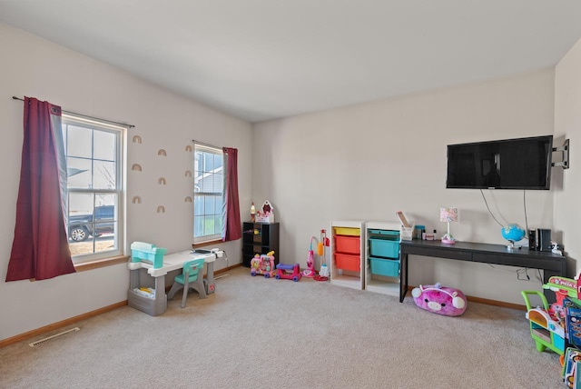 recreation room featuring visible vents, carpet floors, and baseboards