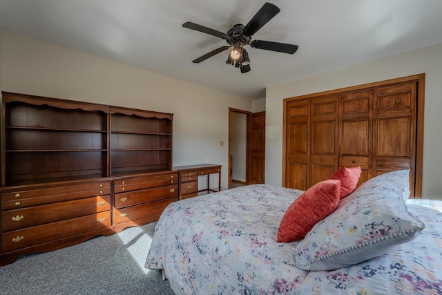 bedroom with a ceiling fan, a closet, and carpet floors