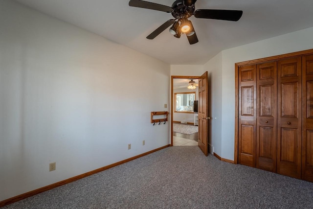 unfurnished bedroom featuring a closet, baseboards, light colored carpet, and ceiling fan