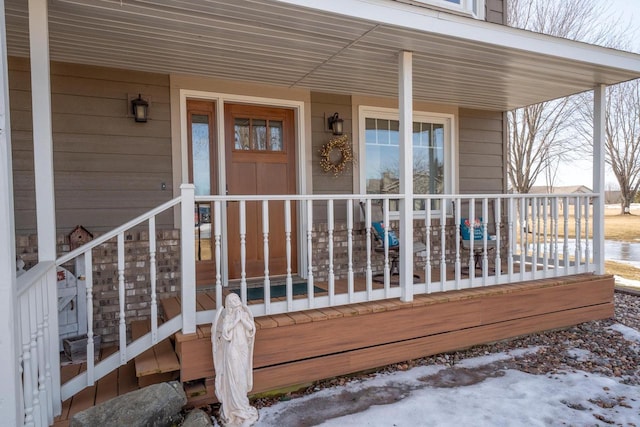 wooden deck featuring covered porch