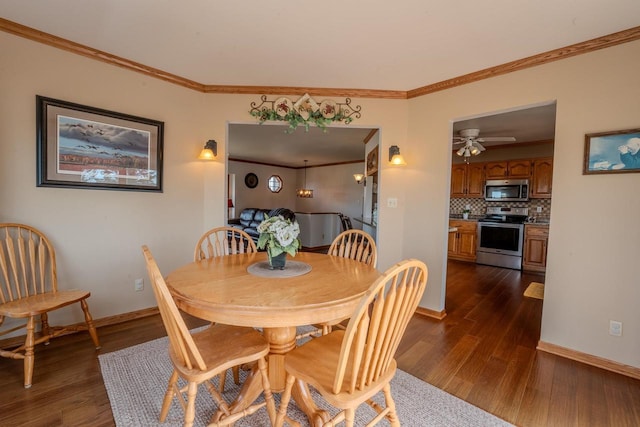 dining area with crown molding, baseboards, and dark wood-style flooring