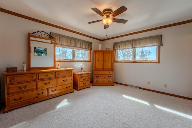 unfurnished bedroom featuring visible vents, multiple windows, and crown molding