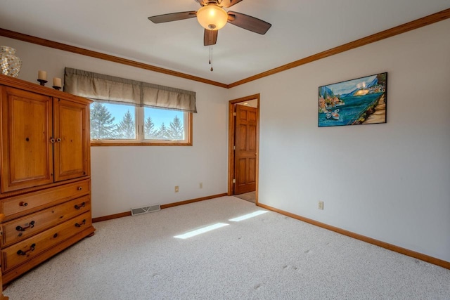 bedroom with visible vents, ornamental molding, a ceiling fan, carpet, and baseboards