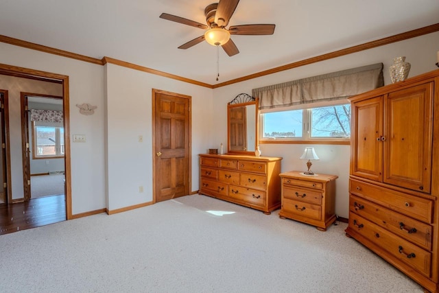 bedroom with light carpet, ceiling fan, baseboards, and ornamental molding