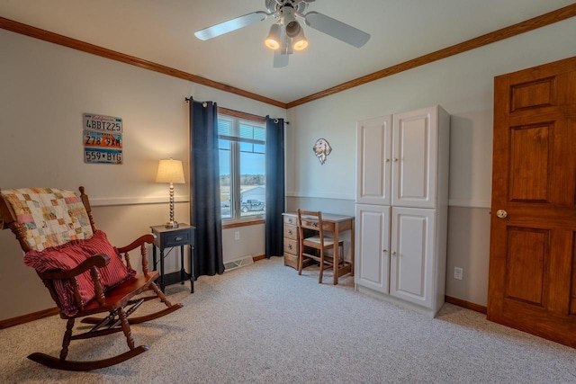 sitting room with a ceiling fan, visible vents, baseboards, light carpet, and crown molding