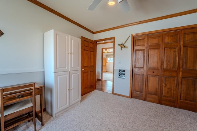 bedroom with light carpet, a ceiling fan, and crown molding