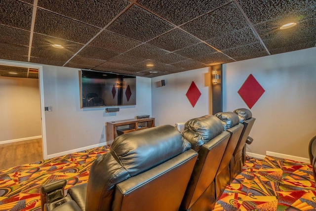 cinema with baseboards and wood finished floors