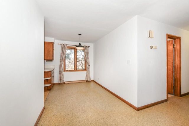 interior space featuring baseboards