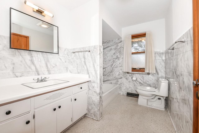 bathroom featuring toilet, tile walls, speckled floor, a bath, and vanity