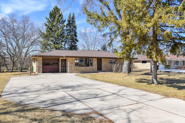 single story home featuring brick siding, a garage, driveway, and a front yard