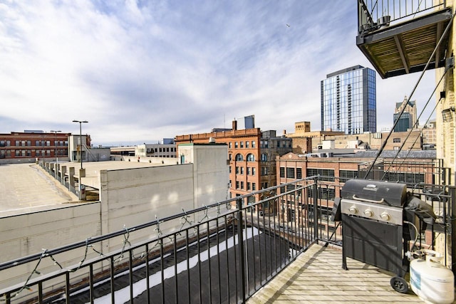 balcony featuring grilling area and a view of city