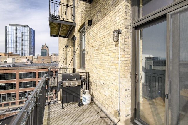 balcony featuring a city view and grilling area