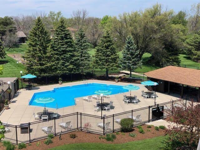 pool featuring a patio and fence