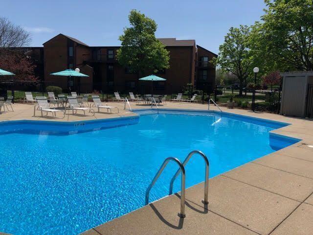 pool featuring a patio and fence