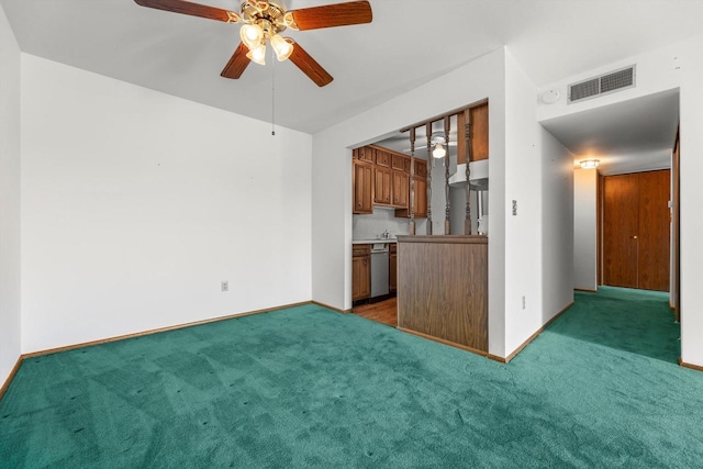 interior space with visible vents, carpet flooring, a ceiling fan, and stainless steel dishwasher